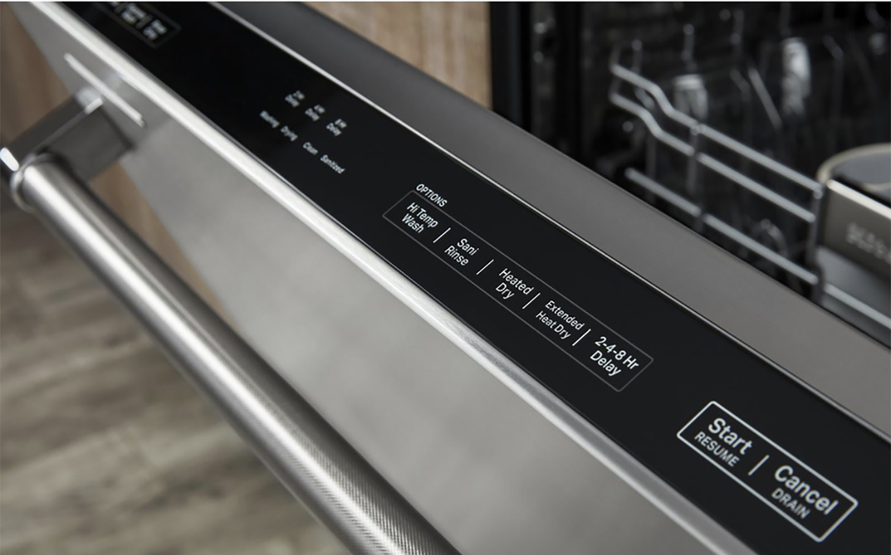 A side angle of a KitchenAid dishwasher showing the buttons.
